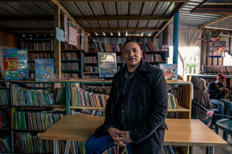 Terence Crowster, a development worker who has been an avid reader since he was young, solicited donations to start the Hot-Spot Library in Scottsville, Cape Town, so kids would have a safe place to connect with books. Terence Crowster, a development worker who has been an avid reader since he was young, solicited donations to start the Hot-Spot Library in Scottsville, Cape Town, so kids would have a safe place to connect with books.
