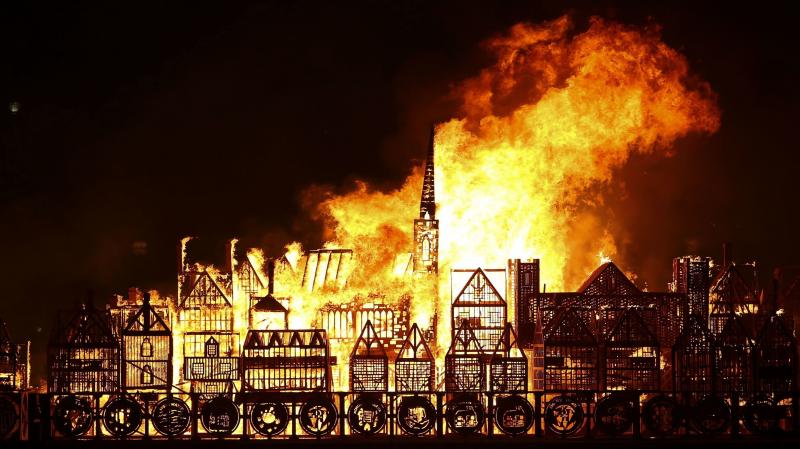 A flaming replica of 17th-century London floats on the River Thames on Sunday, part of an event to mark the 350th anniversary of the Great Fire of London. A flaming replica of 17th-century London floats on the River Thames on Sunday, part of an event to mark the 350th anniversary of the Great Fire of London.