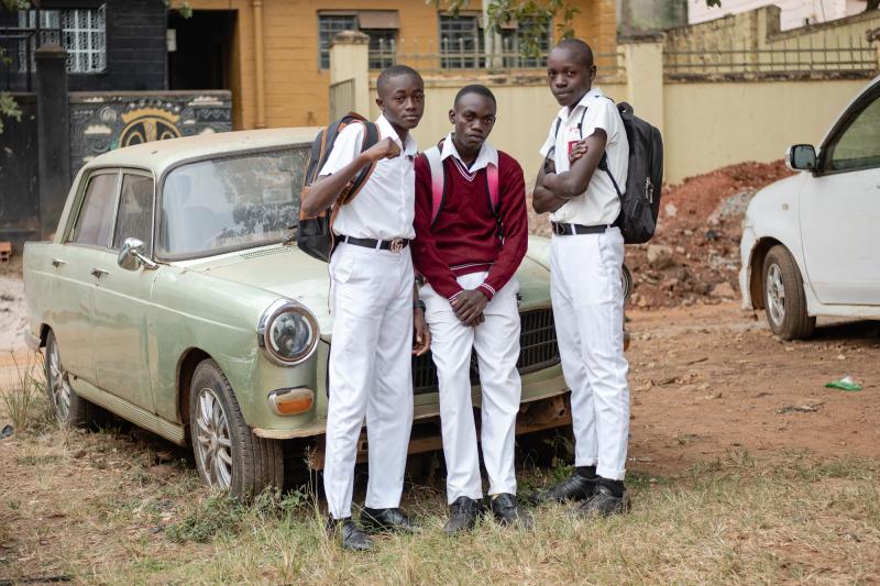 Kusemererwa Jonathan Henry, Joel Joseph (left and middle) and a friend pose for a photo on their way home from school. During the lockdown, they missed spending time in school together and would walk to visit each other. Kusemererwa Jonathan Henry, Joel Joseph (left and middle) and a friend pose for a photo on their way home from school. During the lockdown, they missed spending time in school together and would walk to visit each other.