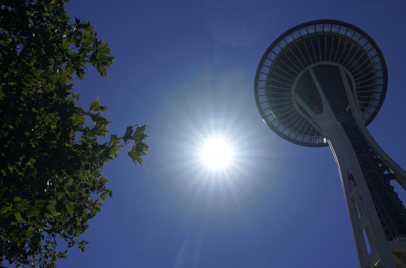 The sun shines near the Space Needle, Monday, June 28, 2021, in Seattle. Seattle and other cities broke all-time heat records over the weekend, with temperatures soaring well above 100 degrees. The sun shines near the Space Needle, Monday, June 28, 2021, in Seattle. Seattle and other cities broke all-time heat records over the weekend, with temperatures soaring well above 100 degrees.