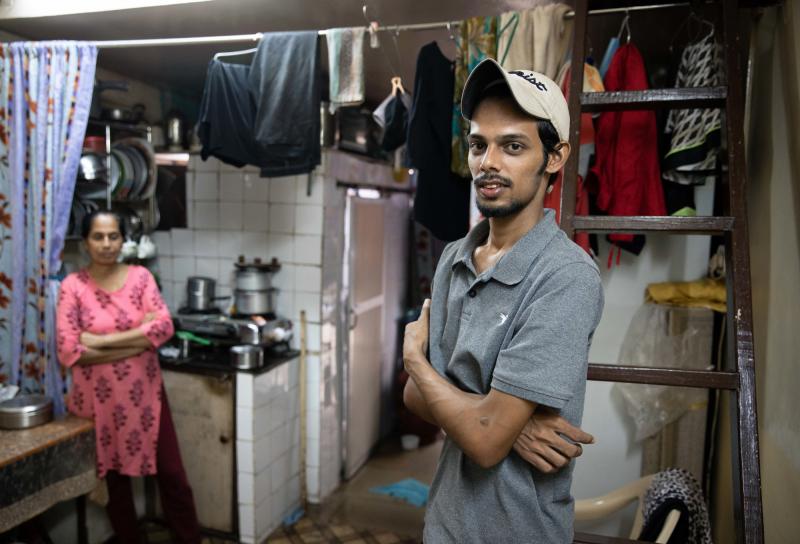 Salman Khan Rashid, 24, right, and his mother, Sana Rashid, at home. Salman lost his job as a golf coach at a Mumbai sports club during the pandemic. The household, which includes Salman's three sisters, is now surviving on savings. But when he's able, he Salman Khan Rashid, 24, right, and his mother, Sana Rashid, at home. Salman lost his job as a golf coach at a Mumbai sports club during the pandemic. The household, which includes Salman's three sisters, is now surviving on savings. But when he's able, he
