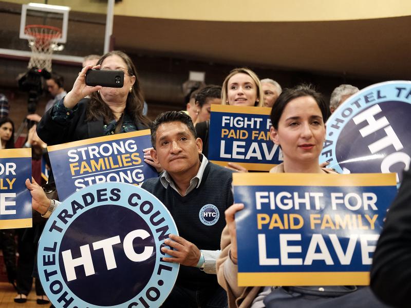 Supporters watch as New York Gov. Andrew Cuomo speaks to promote his paid family leave initiative at a rally in Manhattan on March 10. Supporters watch as New York Gov. Andrew Cuomo speaks to promote his paid family leave initiative at a rally in Manhattan on March 10.
