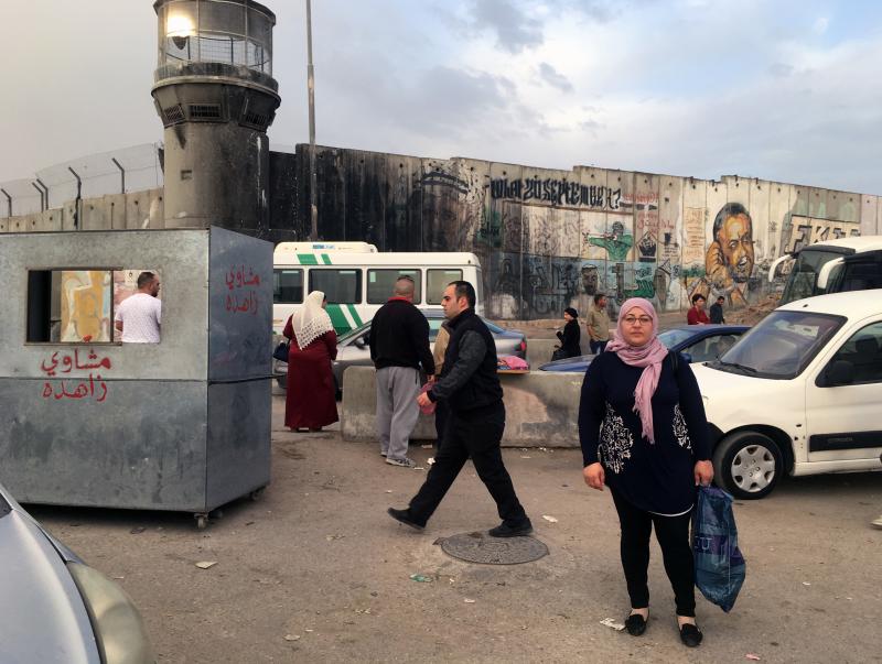 Raja Tamimi must cross the Qalandia checkpoint to commute to her job in Jerusalem's Old City. Raja Tamimi must cross the Qalandia checkpoint to commute to her job in Jerusalem's Old City.