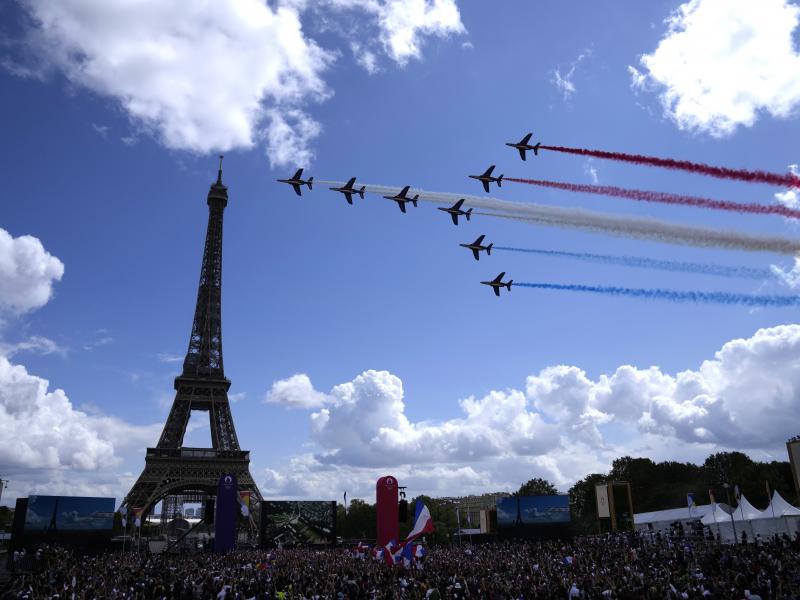 The French Aerial Patrol fly by the Eiffel Tower in Paris as part of the handover ceremony of Tokyo 2020 to Paris 2024, as Paris will be the next Summer Games host in 2024. The French Aerial Patrol fly by the Eiffel Tower in Paris as part of the handover ceremony of Tokyo 2020 to Paris 2024, as Paris will be the next Summer Games host in 2024.