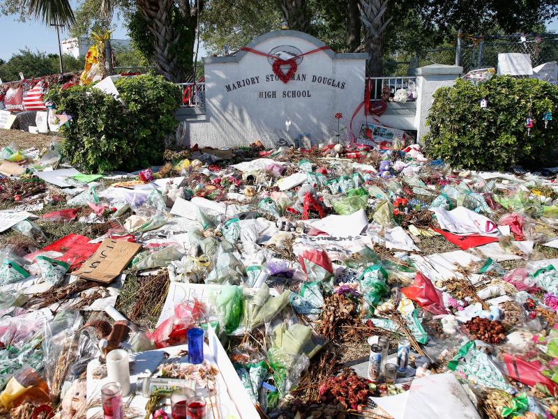 A general view of the makeshift memorial in front of Marjory Stoneman Douglas High School in Parkland, Florida on March 14, 2018. / AFP PHOTO / RHONA WISE (Photo credit should read RHONA WISE/AFP/Getty Images) A general view of the makeshift memorial in front of Marjory Stoneman Douglas High School in Parkland, Florida on March 14, 2018. / AFP PHOTO / RHONA WISE (Photo credit should read RHONA WISE/AFP/Getty Images)