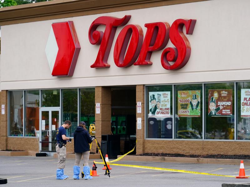 Investigators work the scene of a shooting at a supermarket in Buffalo, N.Y. on Monday. Investigators work the scene of a shooting at a supermarket in Buffalo, N.Y. on Monday.