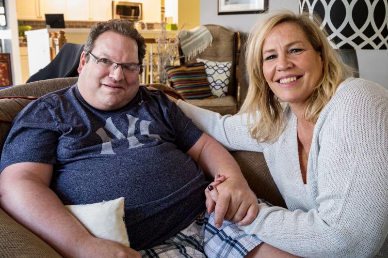 Neal Siegel, who lives with his girlfriend, Beth Wargo, is one of six disabled Iowans suing the state over its privatized Medicaid program. Neal Siegel, who lives with his girlfriend, Beth Wargo, is one of six disabled Iowans suing the state over its privatized Medicaid program.