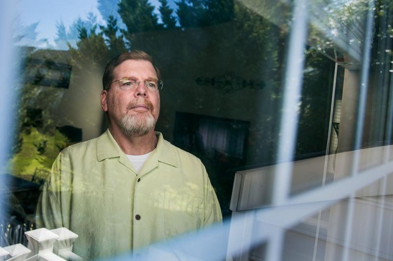 Tom Murphy, 56, in his home in Gainesville, Va., was diagnosed with ALS four years ago. An experimental drug seems to have slowed the progression of his disease, he says, though most ALS patients aren't as lucky. Tom Murphy, 56, in his home in Gainesville, Va., was diagnosed with ALS four years ago. An experimental drug seems to have slowed the progression of his disease, he says, though most ALS patients aren't as lucky.