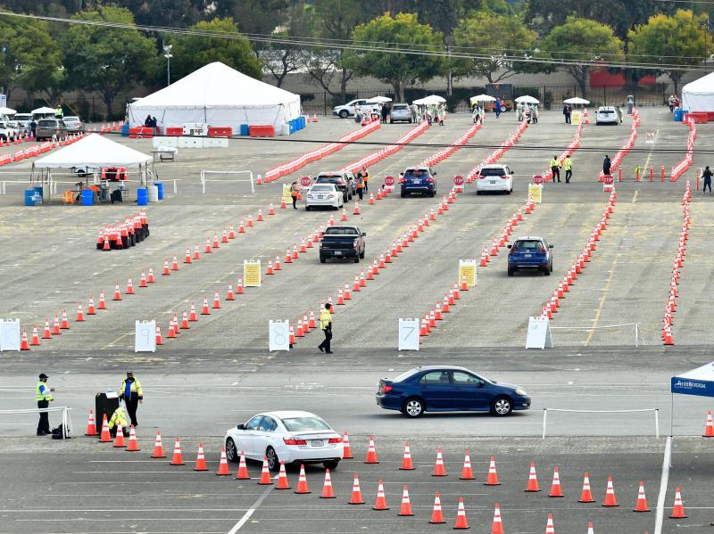 People wait for COVID-19 vaccinations in their vehicles at the Fairplex fairgrounds in Pomona, Calif., last month. The White House announced on Friday that active duty military personnel will soon be deployed to assist at vaccination sites, starting this People wait for COVID-19 vaccinations in their vehicles at the Fairplex fairgrounds in Pomona, Calif., last month. The White House announced on Friday that active duty military personnel will soon be deployed to assist at vaccination sites, starting this