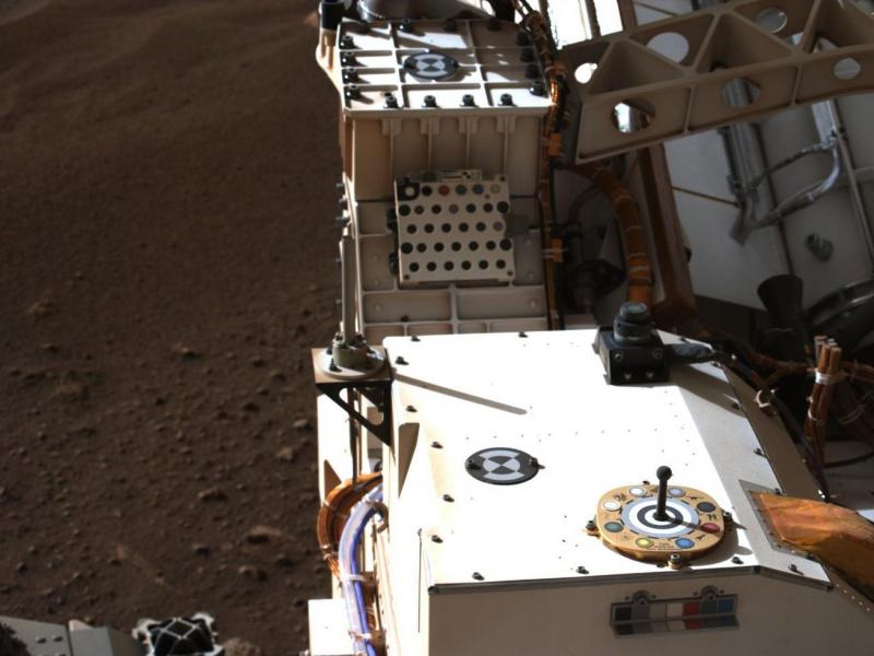 This photo of the Rover includes a view of color chips used to calibrate the images from Mars. This photo of the Rover includes a view of color chips used to calibrate the images from Mars.