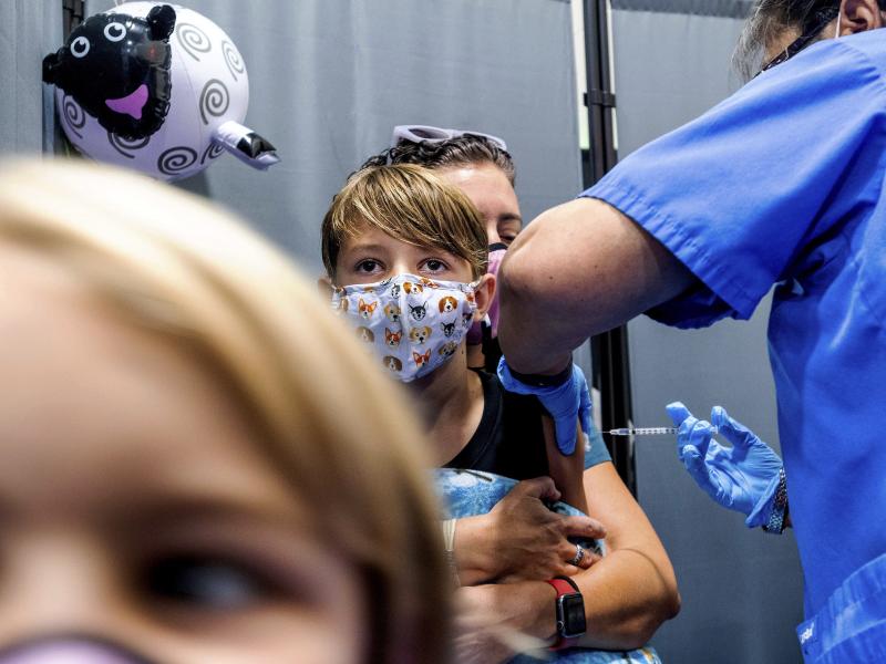 Finn Washburn, 9, receives an injection of the Pfizer-BioNTech COVID-19 vaccine in San Jose, Calif., in November. Now the pharmaceutical companies are seeking authorization to give kids a booster dose of the vaccine. Finn Washburn, 9, receives an injection of the Pfizer-BioNTech COVID-19 vaccine in San Jose, Calif., in November. Now the pharmaceutical companies are seeking authorization to give kids a booster dose of the vaccine.