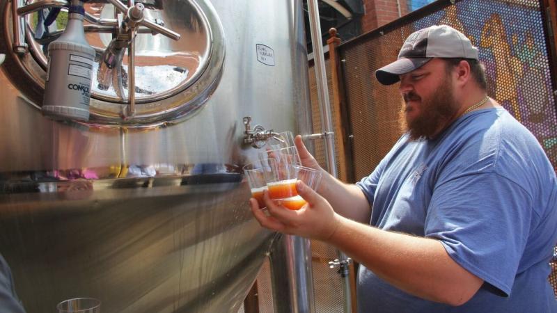 Evan Fritz, head brewer at Manayunk Brewing Co., draws off some samples of Papal Pleasure, a beer concocted to mark Pope Francis' visit to Philadelphia. It's brewed with water blessed by a local priest. Evan Fritz, head brewer at Manayunk Brewing Co., draws off some samples of Papal Pleasure, a beer concocted to mark Pope Francis' visit to Philadelphia. It's brewed with water blessed by a local priest.