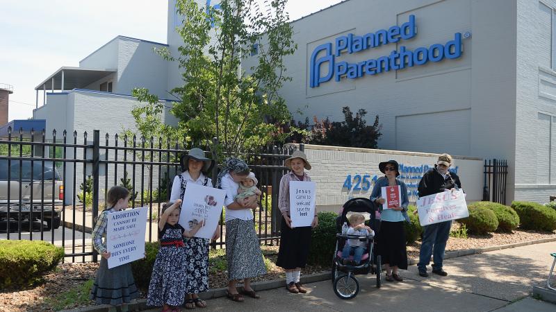 A group of anti-abortion rights protesters hold signs during a rally outside a Planned Parenthood Reproductive Health Center in St Louis, Mo., in June. A group of anti-abortion rights protesters hold signs during a rally outside a Planned Parenthood Reproductive Health Center in St Louis, Mo., in June.