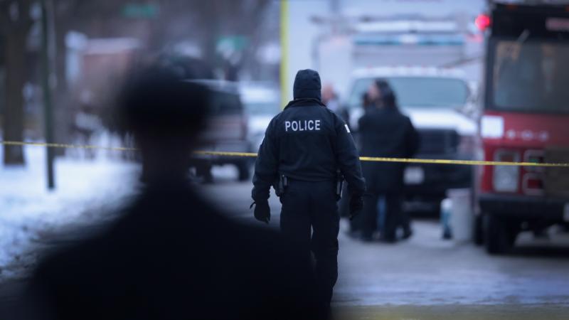 Police investigate the scene of a quadruple homicide in Chicago on Dec. 17. Police investigate the scene of a quadruple homicide in Chicago on Dec. 17.