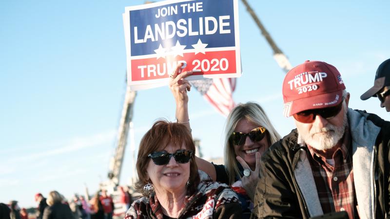 Supporters arrive for a President Trump rally in Valdosta, Ga., last weekend. Fewer than half of Trump backers said they would get the COVID-19 vaccine in a new poll. Supporters arrive for a President Trump rally in Valdosta, Ga., last weekend. Fewer than half of Trump backers said they would get the COVID-19 vaccine in a new poll.