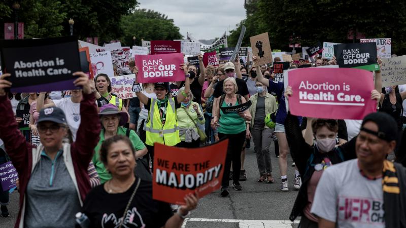 Pro-abortion rights demonstrators march in Washington, D.C., on May 14. While most U.S. adults favor some restrictions on abortion, according to our new poll, most also say they do not support overturning Roe v. Wade. Pro-abortion rights demonstrators march in Washington, D.C., on May 14. While most U.S. adults favor some restrictions on abortion, according to our new poll, most also say they do not support overturning Roe v. Wade.