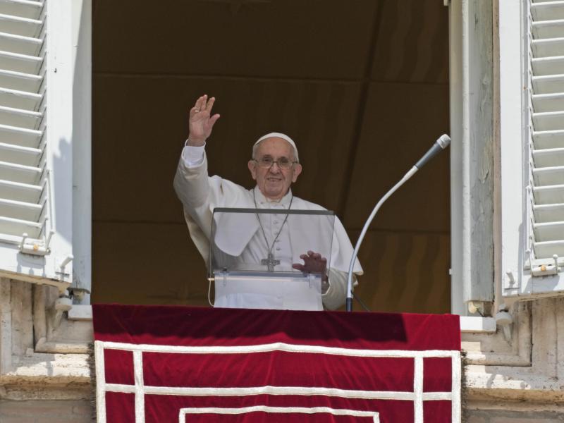 Pope Francis salutes the crowd as he arrives for the Angelus noon prayer from the window of his studio overlooking St. Peter's Square at the Vatican on Sunday. Pope Francis salutes the crowd as he arrives for the Angelus noon prayer from the window of his studio overlooking St. Peter's Square at the Vatican on Sunday.
