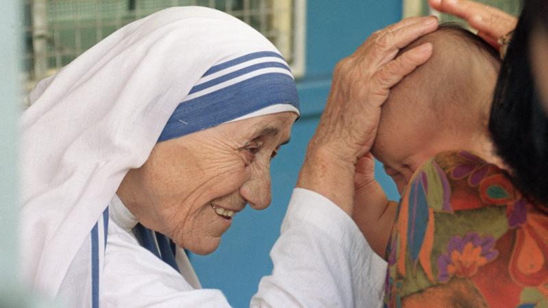 Mother Teresa, seen here giving her blessing to a child in 1993, will be made a saint, after Pope Francis issued a decree recognizing a second miracle attributed to her. Mother Teresa, seen here giving her blessing to a child in 1993, will be made a saint, after Pope Francis issued a decree recognizing a second miracle attributed to her.