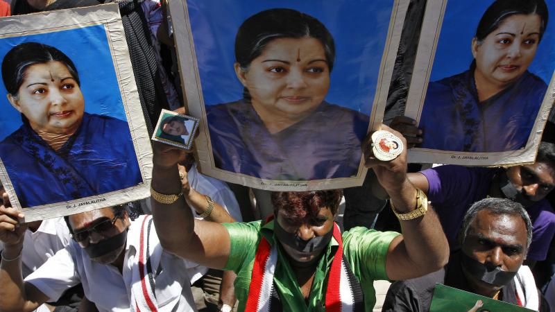 Supporters of J. Jayalalithaa, chief minister of India's Tamil Nadu state and head of the AIADMK party, hold a protest against a prison sentence for the popular politician in the southern Indian city of Chennai Sunday. Supporters of J. Jayalalithaa, chief minister of India's Tamil Nadu state and head of the AIADMK party, hold a protest against a prison sentence for the popular politician in the southern Indian city of Chennai Sunday.