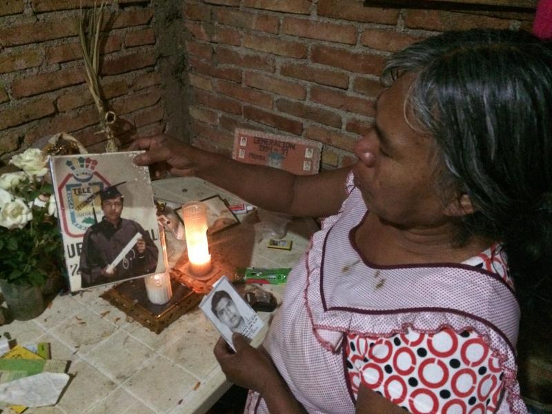 Natividad de la Cruz Bartolo shows a picture of her son, Emiliano, one of 43 university students who went missing months ago. Natividad de la Cruz Bartolo shows a picture of her son, Emiliano, one of 43 university students who went missing months ago.