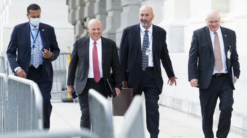 Postmaster General Louis DeJoy, second from left, leaves the U.S. Capitol after meeting Wednesday with Democratic leaders. Postmaster General Louis DeJoy, second from left, leaves the U.S. Capitol after meeting Wednesday with Democratic leaders.