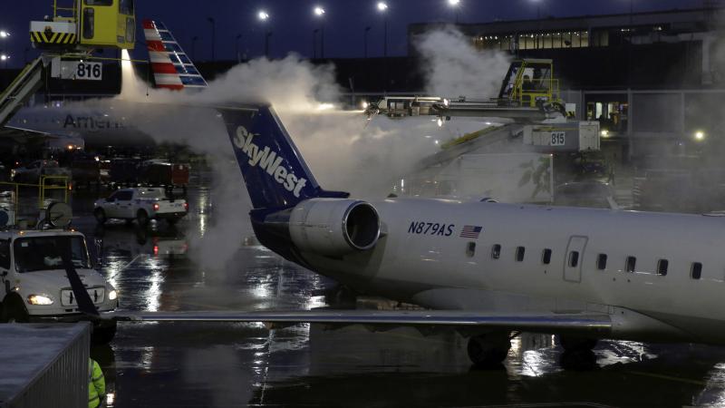 A deicing agent is applied to a SkyWest airplane before its takeoff on Jan. 18, 2019, at O'Hare International Airport in Chicago. A deicing agent is applied to a SkyWest airplane before its takeoff on Jan. 18, 2019, at O'Hare International Airport in Chicago.