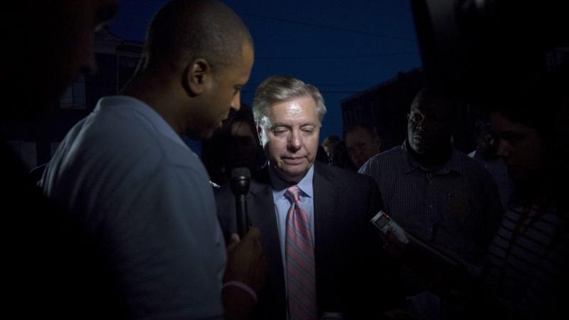 Sen. Lindsey Graham, R-S.C., speaks to members of the media after visiting the memorial site at the Emanuel African Methodist Episcopal Church in Charleston, S.C., where nine people were killed. Sen. Lindsey Graham, R-S.C., speaks to members of the media after visiting the memorial site at the Emanuel African Methodist Episcopal Church in Charleston, S.C., where nine people were killed.