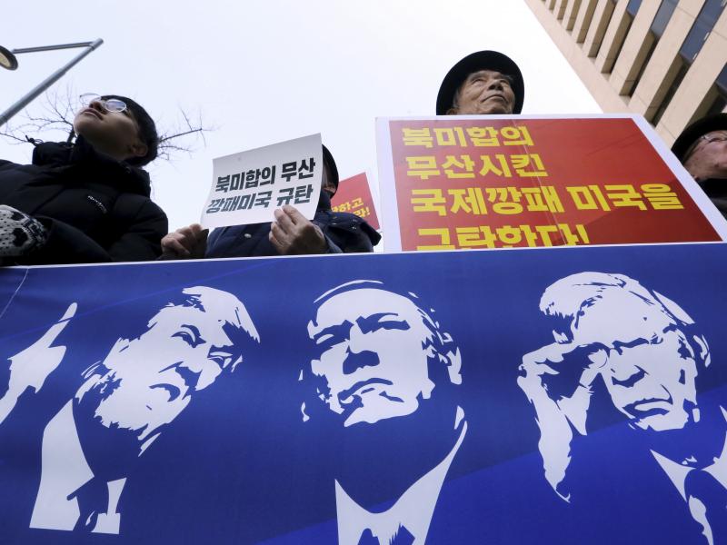 Protesters hold a banner showing images, of President Trump, Secretary of State Mike Pompeo, and National Security Adviser John Bolton during a rally against U.S. sanctions on North Korea, near the U.S. Embassy in Seoul, South Korea. Protesters hold a banner showing images, of President Trump, Secretary of State Mike Pompeo, and National Security Adviser John Bolton during a rally against U.S. sanctions on North Korea, near the U.S. Embassy in Seoul, South Korea.