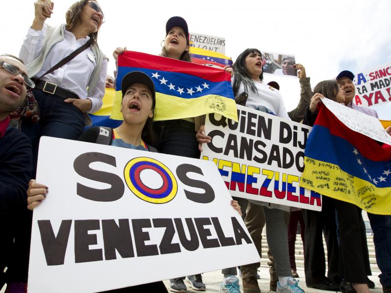 Demonstrators protest President Nicolas Maduro's moves to consolidate his power outside a special meeting of the Organization of American States in Washington on Apr. 3. Demonstrators protest President Nicolas Maduro's moves to consolidate his power outside a special meeting of the Organization of American States in Washington on Apr. 3.