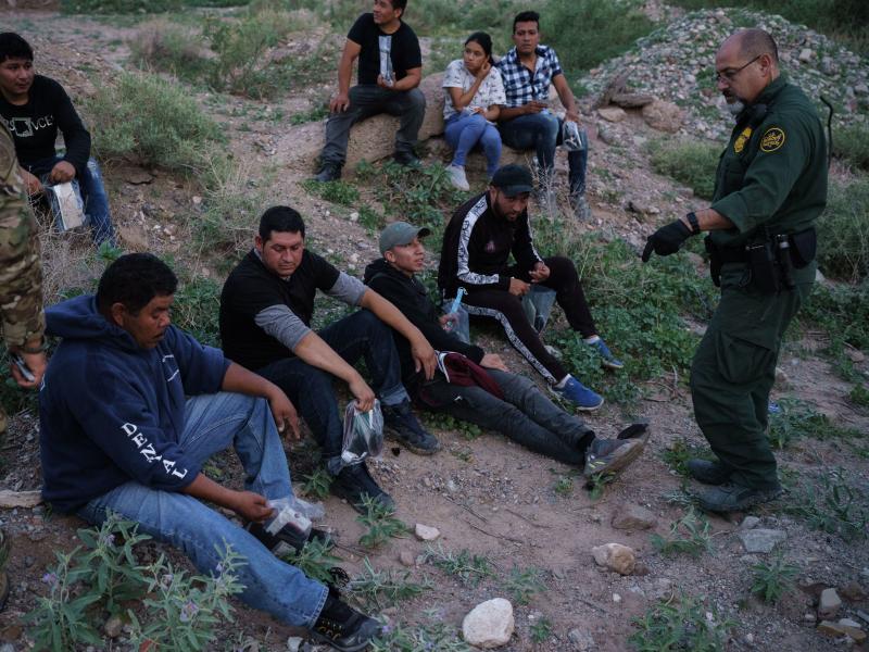 A U.S. Border Patrol agent processes a group of migrants in Sunland Park, New Mexico. Democratic lawmakers and immigrant advocates are urging President Biden to end Title 42 border restrictions. A U.S. Border Patrol agent processes a group of migrants in Sunland Park, New Mexico. Democratic lawmakers and immigrant advocates are urging President Biden to end Title 42 border restrictions.