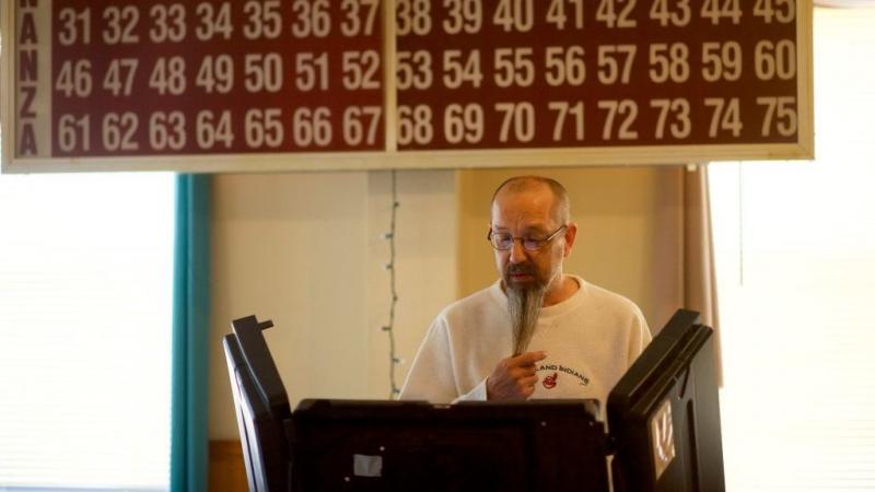 Louis Mithelavage casts his ballot at the Glen Lyon Italian American Sporting Club polling station during the Pennsylvania primary on Tuesday. Louis Mithelavage casts his ballot at the Glen Lyon Italian American Sporting Club polling station during the Pennsylvania primary on Tuesday.