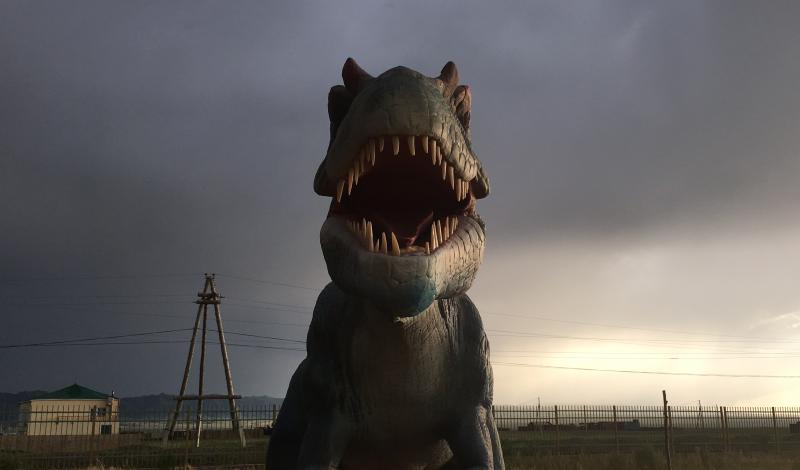 A fake dinosaur is a tourist attraction on the Silk Road in Mongolia. A fake dinosaur is a tourist attraction on the Silk Road in Mongolia.