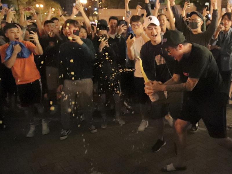 Pro-democracy supporters celebrate after pro-Beijing politician Junius Ho lost his election in Hong Kong, early Monday, Nov. 25, 2019. Pro-democracy supporters celebrate after pro-Beijing politician Junius Ho lost his election in Hong Kong, early Monday, Nov. 25, 2019.