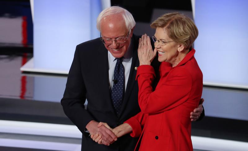 Sens. Bernie Sanders of Vermont and Elizabeth Warren of Massachusetts greet each other at the start of the Democratic presidential debate in Detroit in July. Sens. Bernie Sanders of Vermont and Elizabeth Warren of Massachusetts greet each other at the start of the Democratic presidential debate in Detroit in July.