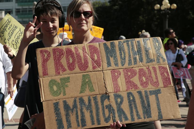 Linda Land-Classon, right, holds up a sign with her 15-year-old son, Ivan, who came to America in 2003 from Vladivostok, Russia, during an immigration rally and protest in Civic Center Park in downtown Denver. Linda Land-Classon, right, holds up a sign with her 15-year-old son, Ivan, who came to America in 2003 from Vladivostok, Russia, during an immigration rally and protest in Civic Center Park in downtown Denver.