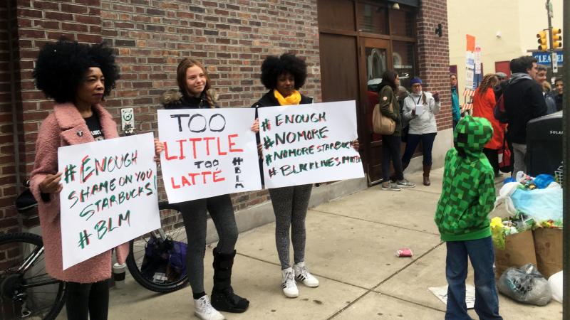Protesters gather outside a Starbucks in Philadelphia on Sunday, where two black men were arrested Thursday after Starbucks employees called police to say the men were trespassing. Protesters gather outside a Starbucks in Philadelphia on Sunday, where two black men were arrested Thursday after Starbucks employees called police to say the men were trespassing.