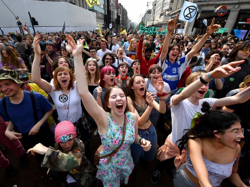 Activists call for government action on climate change in the middle of Oxford Circus on Wednesday in London. Now in their third day of action, protests have blocked a number of key junctions in central London. Activists call for government action on climate change in the middle of Oxford Circus on Wednesday in London. Now in their third day of action, protests have blocked a number of key junctions in central London.