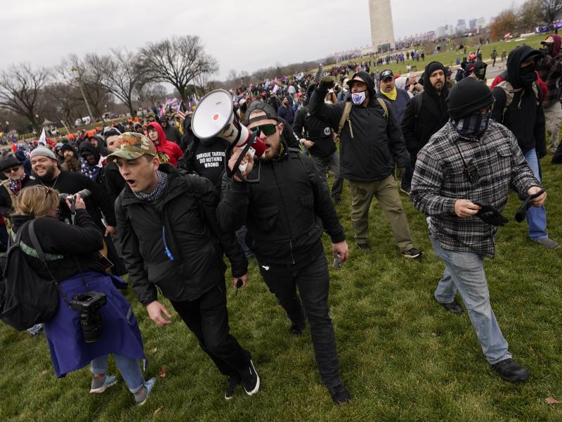 Ethan Nordean, pictured on Jan. 6 with backward baseball hat and bullhorn, leads members of the far-right group Proud Boys in marching before the riot at the U.S. Capitol. Nordean, 30, of Auburn, Washington, has described himself as the sergeant-of-arms o Ethan Nordean, pictured on Jan. 6 with backward baseball hat and bullhorn, leads members of the far-right group Proud Boys in marching before the riot at the U.S. Capitol. Nordean, 30, of Auburn, Washington, has described himself as the sergeant-of-arms o