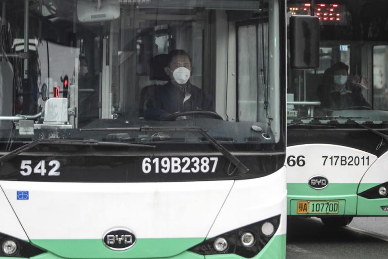 A bus driver wears a mask on Jan. 22 in Wuhan, China. Public transportation is being suspended as of Thursday morning because of concerns about the spreading coronavirus. A bus driver wears a mask on Jan. 22 in Wuhan, China. Public transportation is being suspended as of Thursday morning because of concerns about the spreading coronavirus.