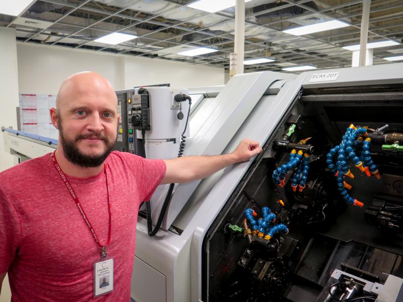 Jared Haley, general manager of the C-Axis plant in Caguas, Puerto Rico, says computer-operated milling machines, like this one can cost more than a half million dollars. Heat and humidity in the plant after Hurricane Maria left many of the machines inope Jared Haley, general manager of the C-Axis plant in Caguas, Puerto Rico, says computer-operated milling machines, like this one can cost more than a half million dollars. Heat and humidity in the plant after Hurricane Maria left many of the machines inope