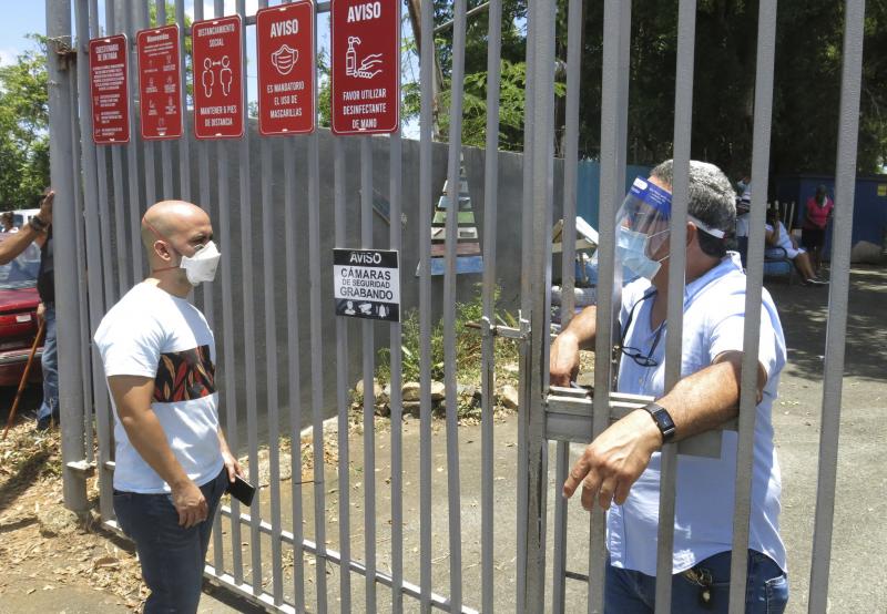 An electoral official (right) tells a voter that ballots haven't arrived at a voting center Sunday in Carolina, Puerto Rico. An electoral official (right) tells a voter that ballots haven't arrived at a voting center Sunday in Carolina, Puerto Rico.