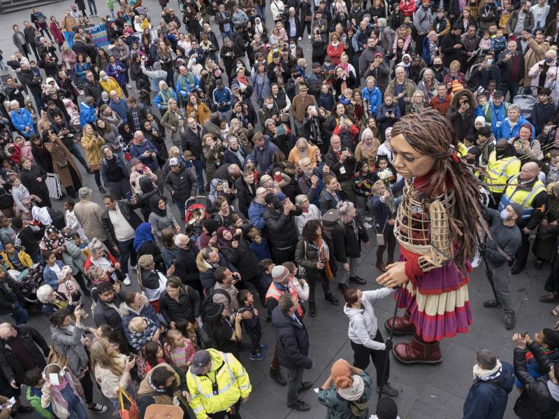 Little Amal delights crowds of onlookers in Coventry, UK, on Oct. 27, 2020. Little Amal delights crowds of onlookers in Coventry, UK, on Oct. 27, 2020.