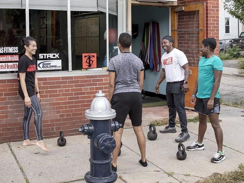 Justice Williams with gym goers and kettlebells at CORE in Brookline, Mass. Justice Williams with gym goers and kettlebells at CORE in Brookline, Mass.