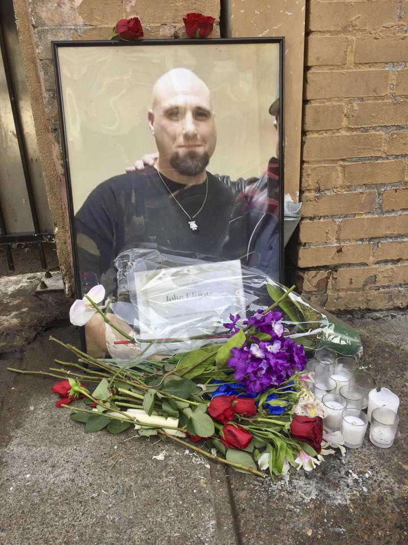 A memorial for John Elifritz, a carjacking suspect who was shot and killed by police, stands on a sidewalk in front of a Portland, Ore., homeless shelter on Monday. Groups and family members are raising questions about whether officers resorted to deadly A memorial for John Elifritz, a carjacking suspect who was shot and killed by police, stands on a sidewalk in front of a Portland, Ore., homeless shelter on Monday. Groups and family members are raising questions about whether officers resorted to deadly