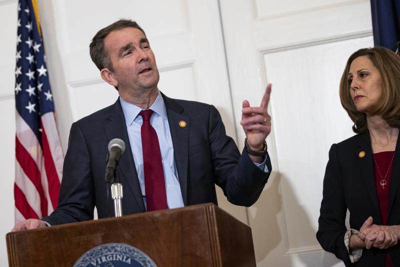 Virginia Gov. Ralph Northam, with his wife Pam, speaks with reporters at a press conference Saturday in Richmond, Va. Virginia Gov. Ralph Northam, with his wife Pam, speaks with reporters at a press conference Saturday in Richmond, Va.