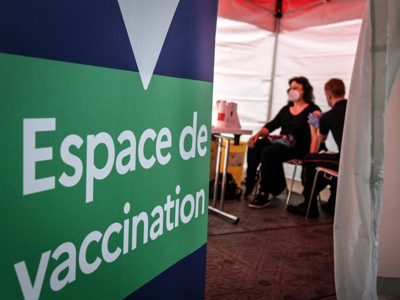 A firefighter administers the Pfizer-BioNTech COVID-19 vaccine at a vaccination center near Paris on Monday. The European Union has signed a deal to buy as many as 1.8 billion doses. A firefighter administers the Pfizer-BioNTech COVID-19 vaccine at a vaccination center near Paris on Monday. The European Union has signed a deal to buy as many as 1.8 billion doses.