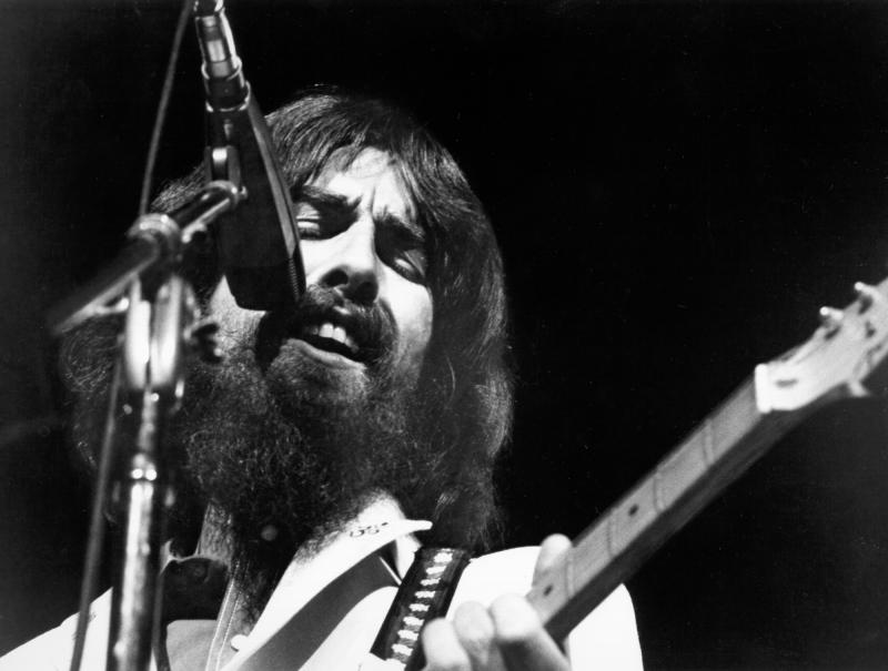 George Harrison performs at the Concert for Bangladesh, held at Madison Square Garden on August 1, 1971 in New York City. Asked why he joined in organizing the event, he said, "Because I was asked by a friend if I'd help, that's all." George Harrison performs at the Concert for Bangladesh, held at Madison Square Garden on August 1, 1971 in New York City. Asked why he joined in organizing the event, he said, "Because I was asked by a friend if I'd help, that's all."