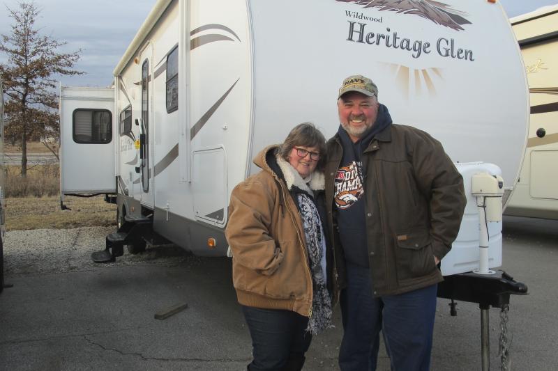 Grant and Cathy Lowe stand in front of a trailer they just bought. It is part of their retirement plans to own this camper, and they intend to have it paid off before they quit working. Grant and Cathy Lowe stand in front of a trailer they just bought. It is part of their retirement plans to own this camper, and they intend to have it paid off before they quit working.