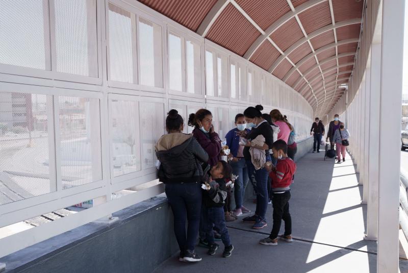 A group of migrants rapidly deported from the U.S. under Title 42 wait on the Mexican side of the Paso del Norte International Bridge, between El Paso, Texas and Ciudad Juarez, Mexico on March 10. A group of migrants rapidly deported from the U.S. under Title 42 wait on the Mexican side of the Paso del Norte International Bridge, between El Paso, Texas and Ciudad Juarez, Mexico on March 10.