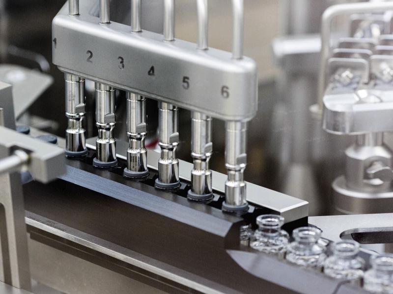 Stoppers are placed on filled vials of the experimental drug remdesivir at a Gilead Sciences factory. Stoppers are placed on filled vials of the experimental drug remdesivir at a Gilead Sciences factory.